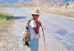 Boy with iguana for supper